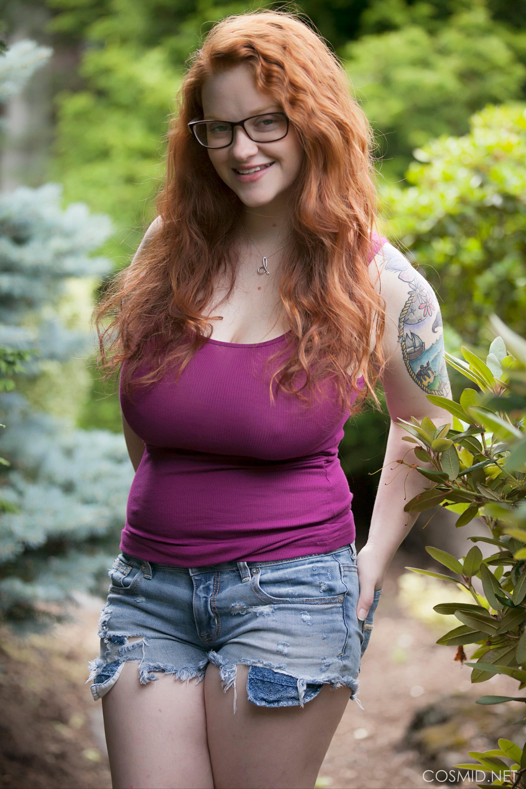 Chubby redhead with big tits Kaycee Barnes looks adorable in her glasses as  she gets nude